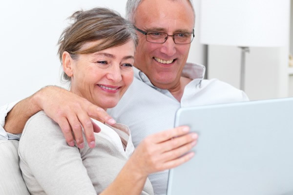 couple looks at laptop